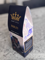 Coffee package with 'Fables' branding on a gray surface