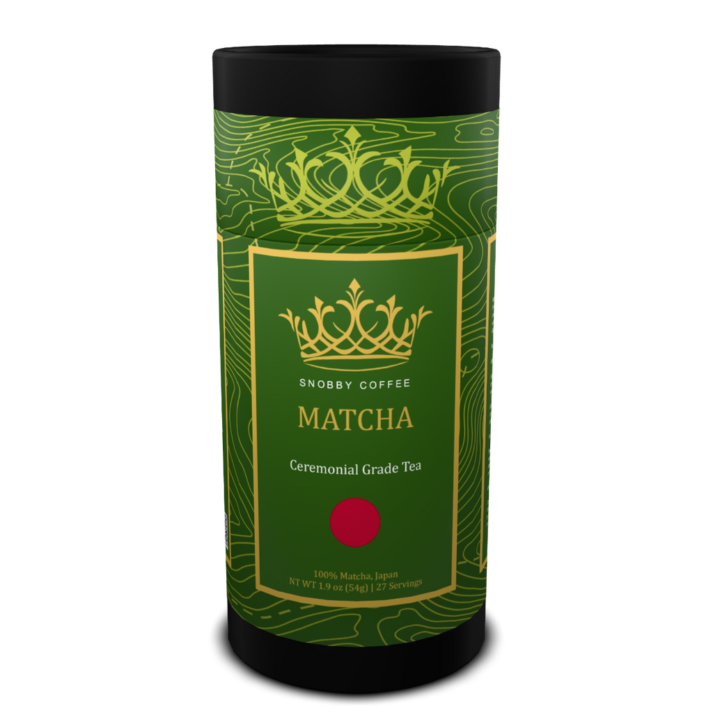 Green and black cylindrical container of Snobby Coffee Matcha tea on a white background