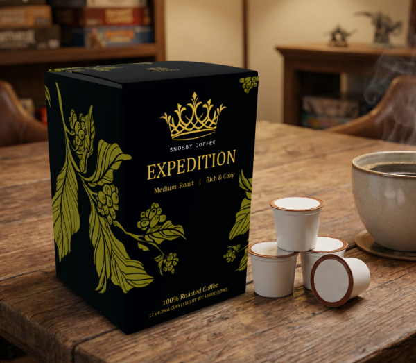 Snobby coffee Expedition Coffee in a black box with coffee plants